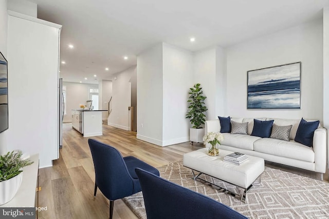 living room with light hardwood / wood-style floors