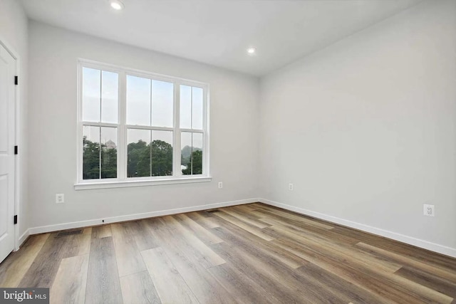 spare room with light wood-type flooring