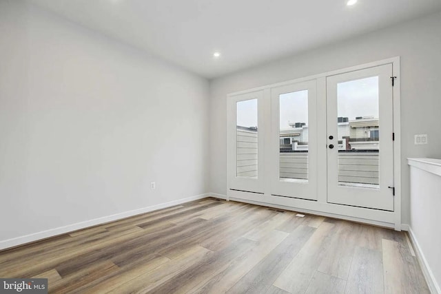 entryway featuring french doors and light hardwood / wood-style flooring