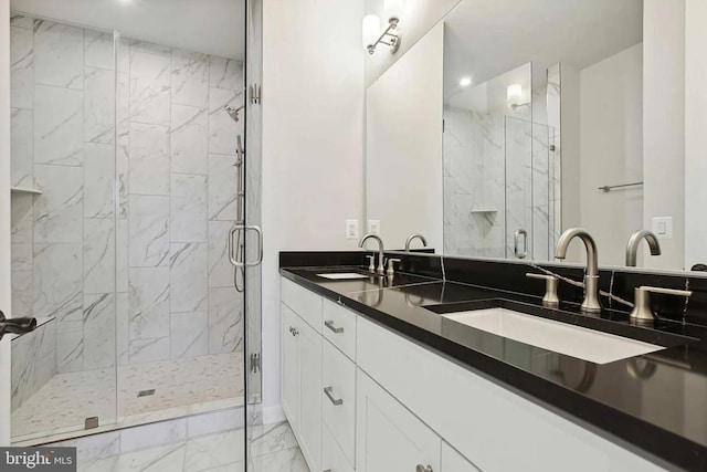 bathroom featuring vanity and a shower with shower door