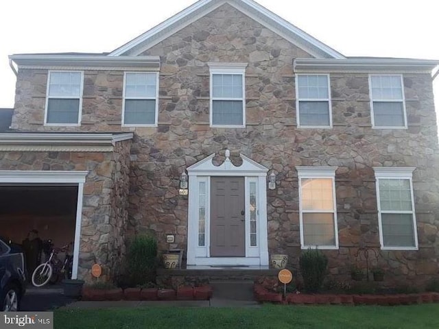 view of front of home with a garage