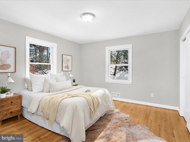 bedroom featuring wood-type flooring