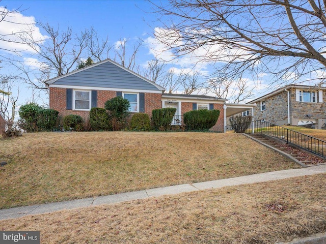 ranch-style home featuring a front yard and a carport