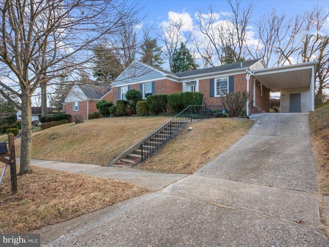 ranch-style house with a front lawn and a carport