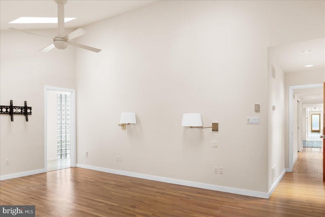 unfurnished living room featuring ceiling fan and wood-type flooring