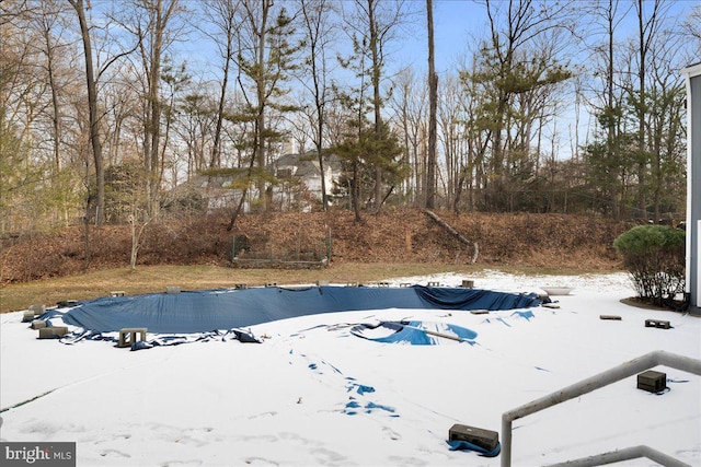 view of snow covered pool