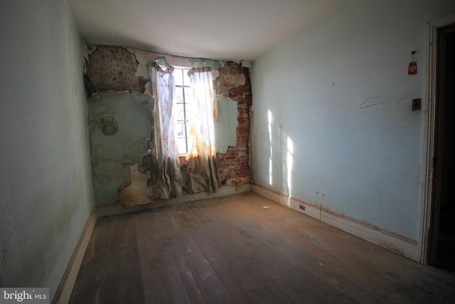 spare room featuring hardwood / wood-style floors