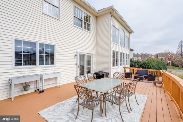 wooden deck featuring outdoor lounge area and outdoor dining area