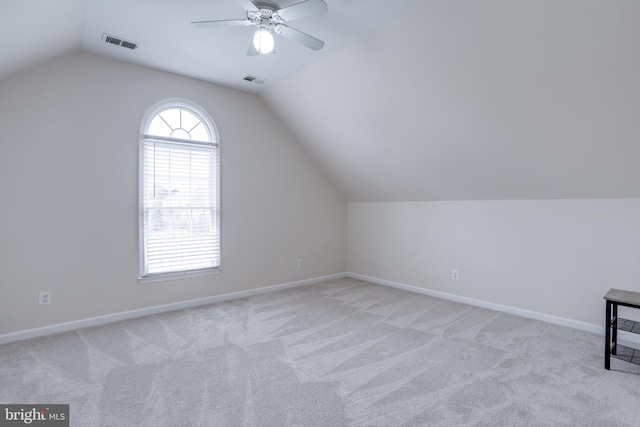 bonus room featuring baseboards, visible vents, carpet floors, lofted ceiling, and ceiling fan