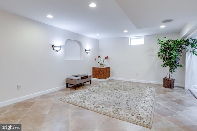 living area featuring light tile patterned floors, recessed lighting, and baseboards