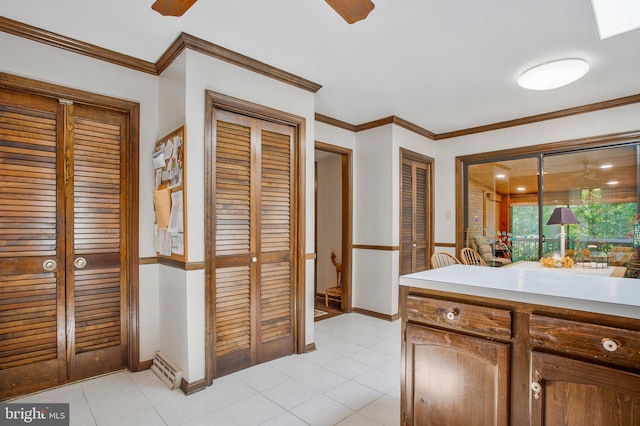 bathroom featuring ceiling fan, tile patterned flooring, vanity, and ornamental molding