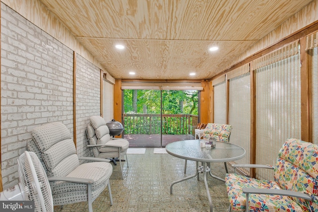 sunroom featuring wooden ceiling