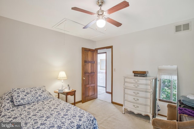 bedroom with ceiling fan and light carpet