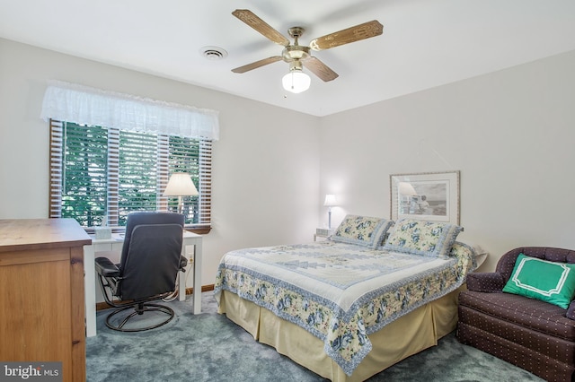 carpeted bedroom with ceiling fan