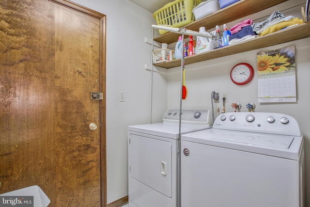 clothes washing area with washer and dryer