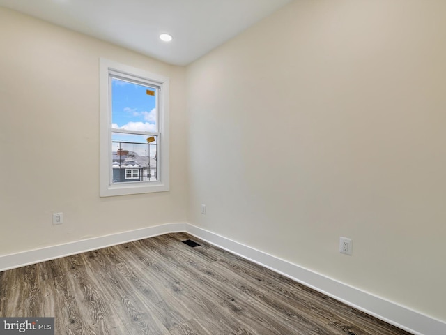 empty room featuring hardwood / wood-style floors