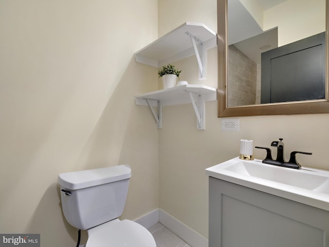 bathroom featuring toilet and vanity