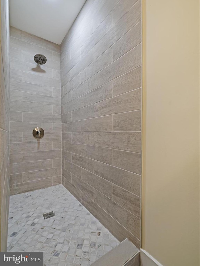 bathroom with tiled shower