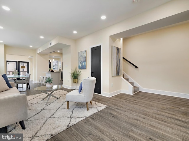 living room featuring dark wood-type flooring