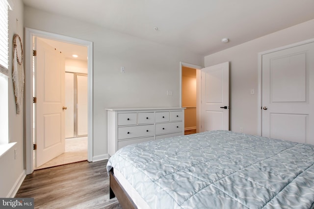 bedroom with hardwood / wood-style floors