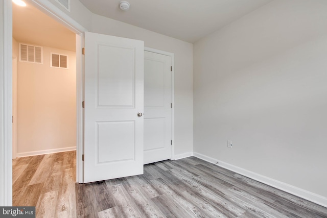 unfurnished bedroom featuring light hardwood / wood-style flooring