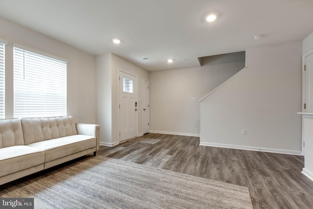 entryway with hardwood / wood-style floors