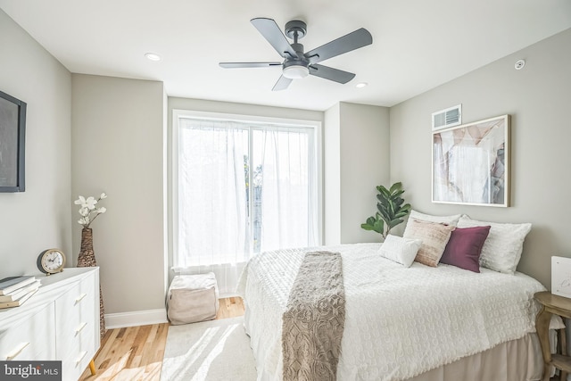 bedroom featuring ceiling fan and light hardwood / wood-style flooring