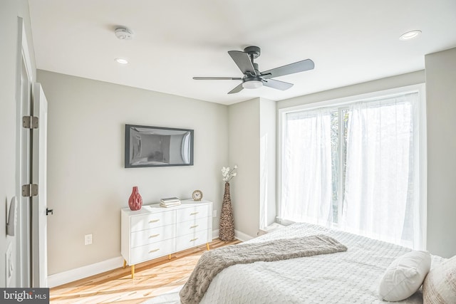 bedroom featuring ceiling fan and light hardwood / wood-style floors