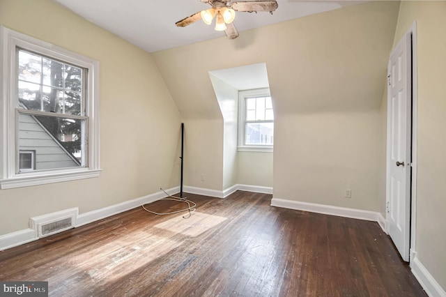 additional living space with dark wood-type flooring, ceiling fan, and vaulted ceiling