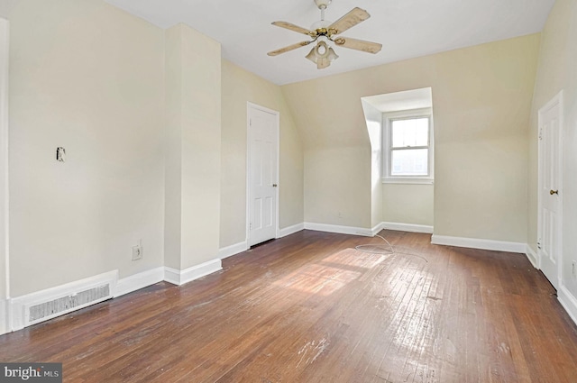 bonus room featuring ceiling fan, dark hardwood / wood-style flooring, and vaulted ceiling