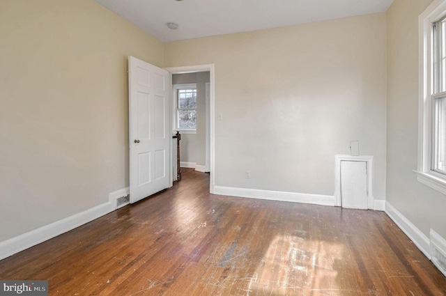 empty room featuring dark hardwood / wood-style floors