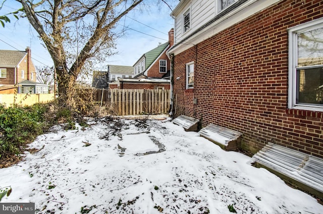 view of yard layered in snow