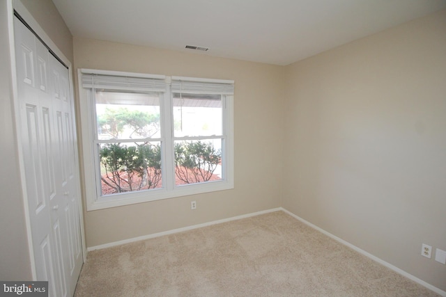 view of carpeted spare room