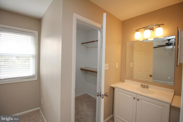 bathroom featuring vanity, plenty of natural light, and ceiling fan