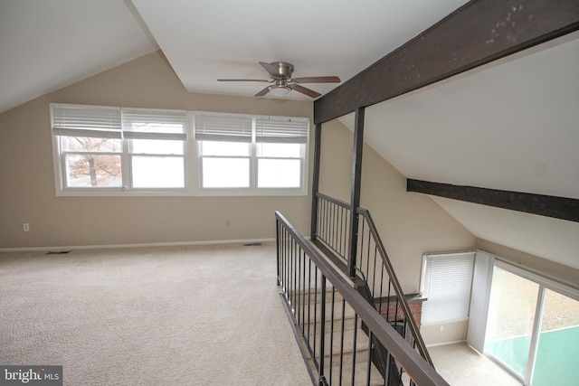 bonus room featuring vaulted ceiling with beams, ceiling fan, and light carpet