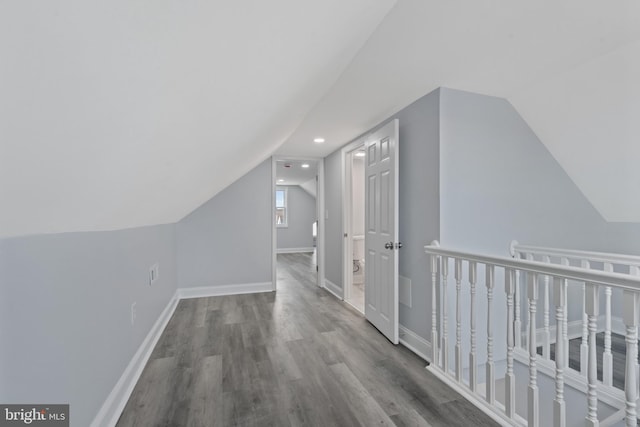 bonus room featuring wood-type flooring and lofted ceiling