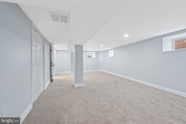 basement with light carpet