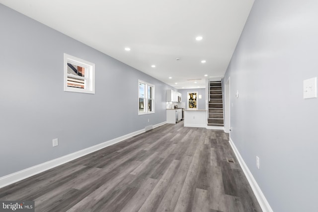 unfurnished living room with hardwood / wood-style floors