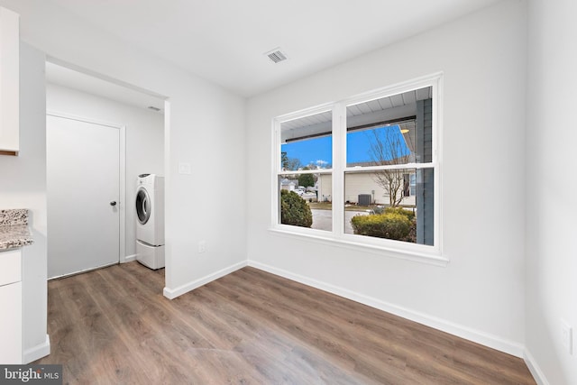 laundry room featuring washer / dryer and hardwood / wood-style flooring