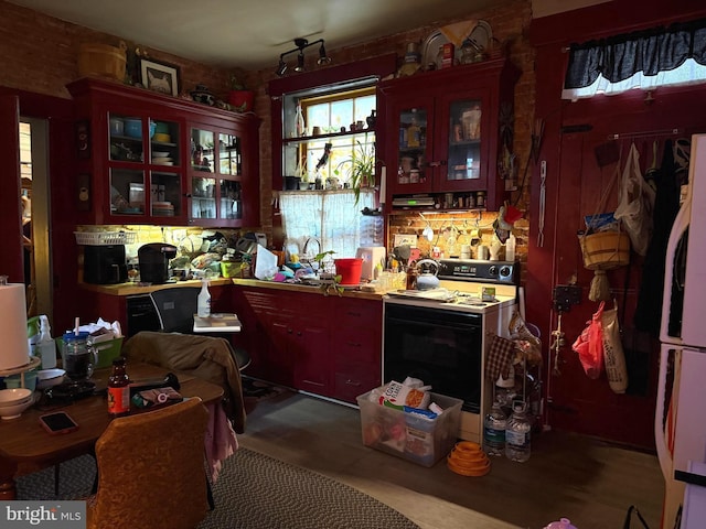 kitchen featuring range with electric stovetop and white refrigerator