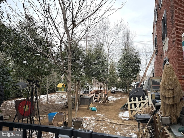 view of yard layered in snow