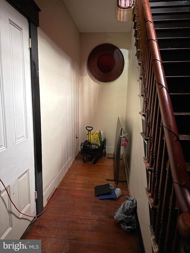 corridor featuring dark hardwood / wood-style flooring