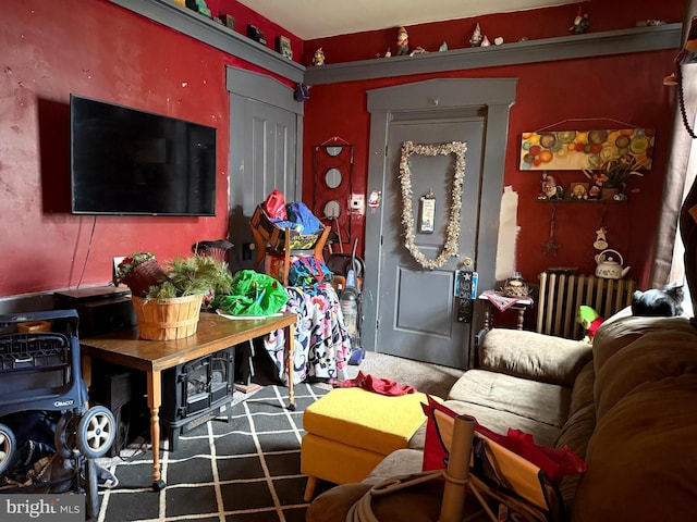 interior space featuring radiator heating unit and carpet flooring