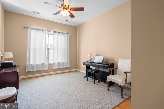 living area featuring ceiling fan