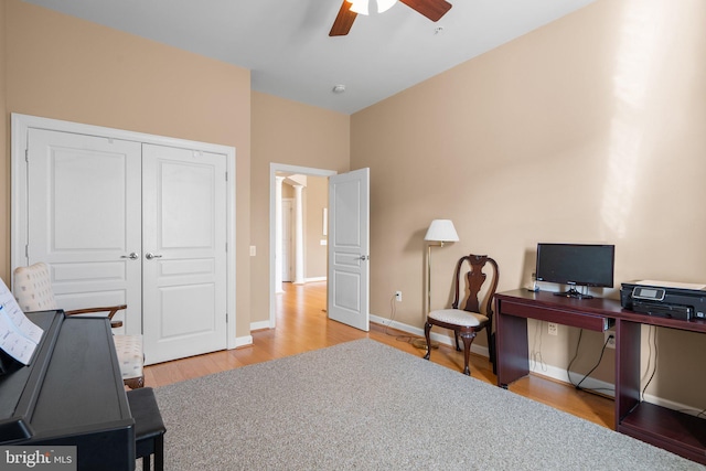 home office featuring hardwood / wood-style flooring and ceiling fan