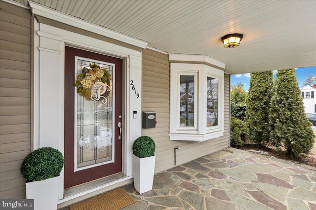 property entrance featuring covered porch