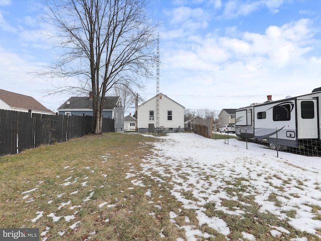 view of yard layered in snow