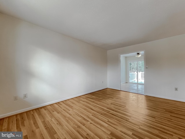 spare room with light hardwood / wood-style flooring