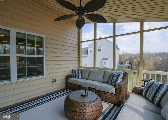 sunroom / solarium featuring ceiling fan