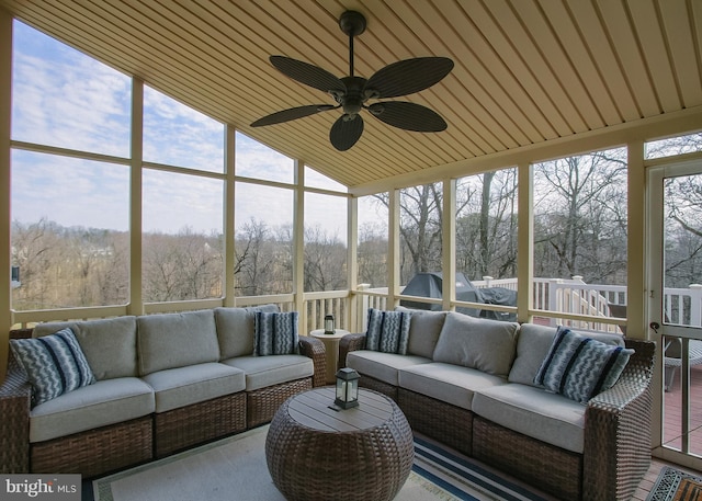 sunroom featuring ceiling fan